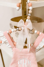 pink white silver baby hanger